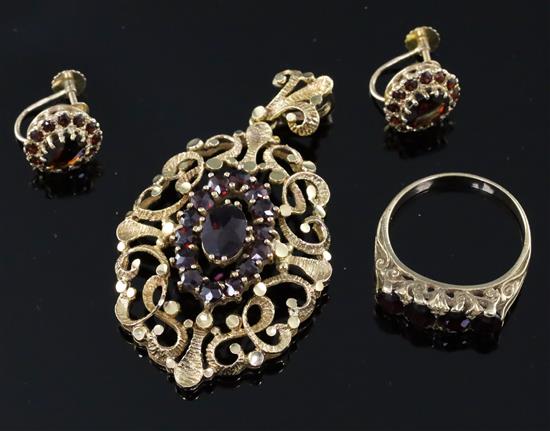 A modern Victorian style suite of 9ct and garnet set jewellery, comprising a ring, pendant and pair of earclips.